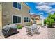 Paver patio in the backyard with dining table, barbecue grill, and lush landscaping at 2154 Tortona St, Henderson, NV 89044
