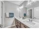 Bathroom featuring dual sinks, quartz countertop, and modern fixtures and hardware at 2154 Tortona St, Henderson, NV 89044