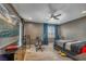 Comfortable bedroom featuring a media center, ceiling fan, desk and chair, and large dresser at 2154 Tortona St, Henderson, NV 89044