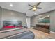 Spacious primary bedroom featuring a ceiling fan, TV, and a large dresser for ample storage at 2154 Tortona St, Henderson, NV 89044