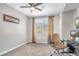 Simple bedroom setup with a work station and window bringing in natural light at 2154 Tortona St, Henderson, NV 89044