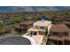 Desirable home featuring a tile roof, porte-cochere, and meticulously maintained landscaping at 2154 Tortona St, Henderson, NV 89044