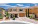 Charming two-story home featuring a tile roof, porte-cochere, and manicured landscaping at 2154 Tortona St, Henderson, NV 89044