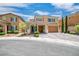 Inviting two-story home with a landscaped front yard and a spacious two-car garage at 2154 Tortona St, Henderson, NV 89044