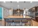Modern kitchen with granite countertops, stainless steel appliances, and a large island with seating at 2154 Tortona St, Henderson, NV 89044