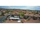 Aerial view showcases the community's layout, parking areas, and lush landscaping amidst residential buildings at 2300 E Silverado Ranch Blvd # 1070, Las Vegas, NV 89183