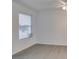 Bright bedroom featuring wood-look floors, a window with blinds, and a ceiling fan at 2300 E Silverado Ranch Blvd # 1070, Las Vegas, NV 89183