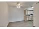 Dining area with a ceiling fan and open access to the kitchen featuring white cabinets at 2300 E Silverado Ranch Blvd # 1070, Las Vegas, NV 89183
