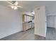 Dining area with a ceiling fan and open access to the kitchen featuring white cabinets and appliances at 2300 E Silverado Ranch Blvd # 1070, Las Vegas, NV 89183