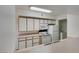 Functional kitchen featuring white appliances and an adjacent laundry area at 2300 E Silverado Ranch Blvd # 1070, Las Vegas, NV 89183
