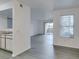 Open-concept living area showcasing updated flooring and access to an outdoor patio at 2300 E Silverado Ranch Blvd # 1070, Las Vegas, NV 89183