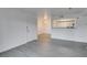 Open-concept living area featuring modern gray wood-look flooring and neutral walls at 2300 E Silverado Ranch Blvd # 1070, Las Vegas, NV 89183