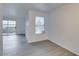 Open living space with wood-look floors and sliding glass doors to a patio at 2300 E Silverado Ranch Blvd # 1070, Las Vegas, NV 89183
