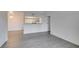 The open-concept living space features modern gray wood-look flooring and bright neutral walls at 2300 E Silverado Ranch Blvd # 1070, Las Vegas, NV 89183