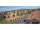 Community buildings, garages, and a row of apartments create a cohesive and inviting neighborhood setting at 2300 E Silverado Ranch Blvd # 1070, Las Vegas, NV 89183