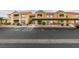 Exterior full view showing a condo complex with parking and walkways at 2300 E Silverado Ranch Blvd # 1070, Las Vegas, NV 89183