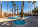 Resort-style pool and spa surrounded by palm trees at 2300 E Silverado Ranch Blvd # 1070, Las Vegas, NV 89183