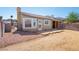 The backyard has dirt, gravel, a brick patio and a small outdoor structure at 2337 Sierra Sunrise St, Las Vegas, NV 89156
