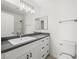 Bright bathroom featuring a gray countertop and a large mirror above the white basin sink at 2337 Sierra Sunrise St, Las Vegas, NV 89156