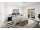 Modern bedroom with a sliding glass door, neutral decor, and comfortable furniture at 2337 Sierra Sunrise St, Las Vegas, NV 89156