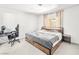 Comfortable bedroom featuring a modern platform bed, workstation, and soft neutral decor at 2337 Sierra Sunrise St, Las Vegas, NV 89156