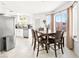 Bright dining area adjacent to the kitchen, featuring a wooden table with garden views at 2337 Sierra Sunrise St, Las Vegas, NV 89156