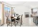 Bright dining area featuring a wooden table, view of the backyard, and neutral decor at 2337 Sierra Sunrise St, Las Vegas, NV 89156