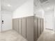 Hallway with wainscoting, tile floor, and multiple doors at 2337 Sierra Sunrise St, Las Vegas, NV 89156