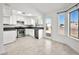Bright kitchen with white cabinetry, stainless steel appliances, and a view to the backyard at 2337 Sierra Sunrise St, Las Vegas, NV 89156