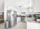 Modern kitchen with stainless steel appliances, white cabinetry, and a neutral countertop at 2337 Sierra Sunrise St, Las Vegas, NV 89156