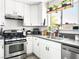 Bright kitchen featuring stainless steel appliances, white cabinetry, and modern fixtures at 2337 Sierra Sunrise St, Las Vegas, NV 89156