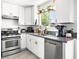 Modern kitchen featuring stainless steel appliances, white cabinetry, and modern fixtures at 2337 Sierra Sunrise St, Las Vegas, NV 89156