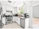 Modern kitchen featuring stainless steel appliances, white cabinetry, and modern fixtures at 2337 Sierra Sunrise St, Las Vegas, NV 89156