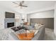 Cozy living room featuring a fireplace, modern decor, and a stylish gray sectional sofa at 2337 Sierra Sunrise St, Las Vegas, NV 89156