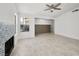 Bright living room with decorative fireplace, tile floors, and modern ceiling fan at 2337 Sierra Sunrise St, Las Vegas, NV 89156