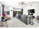Open living room with comfortable seating, a large TV, and natural light at 2337 Sierra Sunrise St, Las Vegas, NV 89156
