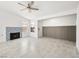 Bright living room featuring a decorative fireplace, tile floors, and recessed lighting at 2337 Sierra Sunrise St, Las Vegas, NV 89156