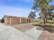 Expansive backyard features a covered patio, mature trees, and plenty of space for outdoor activities and relaxation at 2375 Marion St, Las Vegas, NV 89104