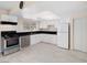 Well-lit kitchen offers stainless steel appliances, white cabinetry, and plenty of storage space for modern living at 2375 Marion St, Las Vegas, NV 89104
