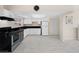 Bright kitchen features white cabinets, stainless appliances, and ample counter space, perfect for cooking and entertaining at 2375 Marion St, Las Vegas, NV 89104
