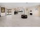 Open-concept living area features sleek tile floors, a cozy fireplace, and convenient access to the kitchen at 2375 Marion St, Las Vegas, NV 89104