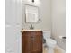 Compact powder room featuring a vanity with a dark wood cabinet and modern fixtures at 258 Chamomile Dr, Henderson, NV 89015