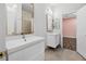 Bathroom featuring dual vanities, tile floors, and a shower at 258 Chamomile Dr, Henderson, NV 89015