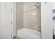 Well-lit bathroom showcasing a tiled shower and tub combination with modern fixtures at 258 Chamomile Dr, Henderson, NV 89015