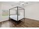 Bedroom with wood flooring and a canopy bed near the window at 258 Chamomile Dr, Henderson, NV 89015