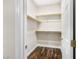 Walk-in closet featuring wood floors and ample shelving space at 258 Chamomile Dr, Henderson, NV 89015
