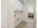 Well-equipped laundry room with storage cabinets, offering convenience and organization at 258 Chamomile Dr, Henderson, NV 89015