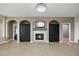 Cozy living room with stone fireplace, built-in shelves, and ample space for entertaining at 258 Chamomile Dr, Henderson, NV 89015