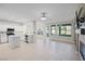 Open floor plan with tile flooring, island kitchen, and access to the backyard at 258 Chamomile Dr, Henderson, NV 89015