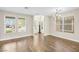 Bright living room with hardwood floors and large windows providing ample natural light at 258 Chamomile Dr, Henderson, NV 89015